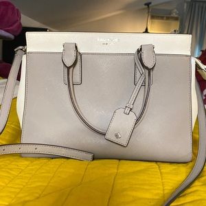 Grey and white medium sized Kate spade crossbody with silver details